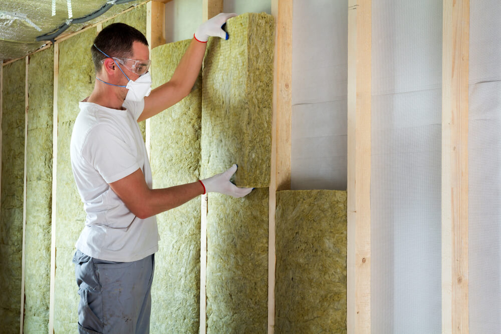 Contractor installing insulation