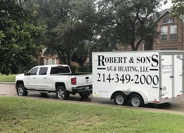Robert and sons trailer being towed behind a truck